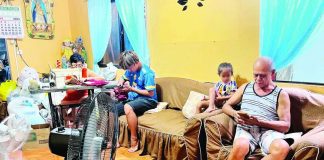 A family in Barotac Nuevo, Iloilo utilizes two electric fans inside their home on Tuesday, May 19, seeking relief as summer temperatures continue to soar. As household appliance use spikes due to the intense summer heat, power distributors across Western Visayas report that peak-hour demand is putting a heavy strain on power reserves, prompting calls for strict energy conservation. PN PHOTO
