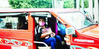 A masked passenger rides a traditional public utility jeepney in Iloilo City as authorities continue to monitor air quality across the metro, which remained under the “good to fair” category based on the Environmental Management Bureau monitoring. The agency, however, reminds vulnerable groups to remain cautious amid changing pollution and weather conditions. PN