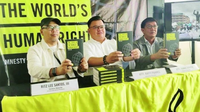 neljoy (1)_compressed Human rights and environmental advocates formally launch Amnesty International Philippines’ State of the World’s Human Rights Report 2025/26 during its Visayas leg in Iloilo City on Tuesday, May 19, 2026. The event gathered key figures including Ritz Lee Santos III of Amnesty International Philippines, Atty. Raffy Pajares of the Environmental Legal Assistance Center, and Atty. Jonnie Dabuco of the Commission on Human Rights Region 6 to discuss global and local human rights issues, including climate change, environmental destruction, and accountability. GIAN CARLO FRANCISCO, UA INTERN