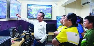 Department of Science and Technology personnel and Tubungan, Iloilo local government representatives observe real-time climate monitoring and forecasting systems during a benchmarking activity under the Climate Field School Program aimed at promoting climate-resilient and science-based farming practices in Iloilo Province. DOST-6