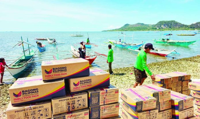 neljoy_delivers_copy_compressed_resized Department of Social Welfare and Development – Region 6 personnel, with the assistance of local residents and partner agencies, unload and transport family food packs to Barangay Gabi in Isla Gigantes, Carles, Iloilo as part of the agency’s “last mile” disaster preparedness initiative aimed at ensuring faster emergency response in geographically isolated island communities. DSWD-6