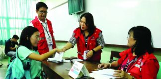 Department of Social Welfare and Development personnel assist a beneficiary during the implementation of the KALAHI-CIDSS program in Western Visayas, one of the community-driven initiatives that have benefitted more than 1.4 million households in the region from 2020 to 2025. DSWD-6