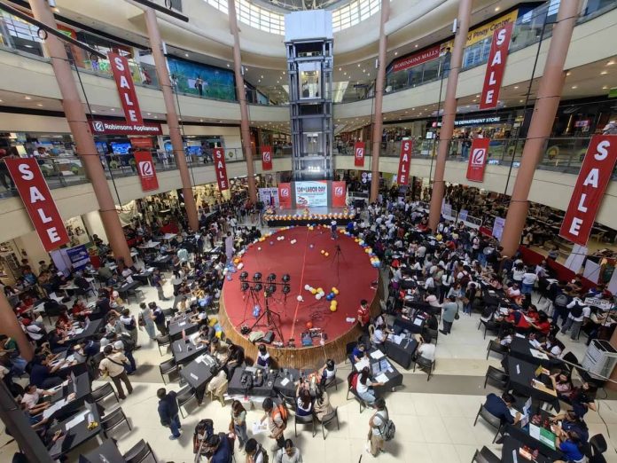 Hundreds of job seekers flock to Robinsons Place Iloilo during the Labor Day Celebration Job Fair organized by the Department of Labor and Employment - Regional Office 6 on May 1, 2026. The event offered around 7,000 local and overseas job opportunities as part of the government’s push to expand employment and livelihood support programs in Western Visayas. DOLE-6