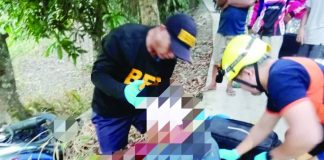 Personnel of the Bureau of Fire Protection (BFP)-Passi City apply first aid to a 27-year-old motorcycle driver who was found unconscious after crashing into a tree in Barangay Cadilang, Passi City, Iloilo early Tuesday morning, May 12. PHOTO BY BFP-PASSI CITY