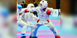 Francis Erl Jud Abundo of the Philippines unleashes a punch against Brunei’s Azlee Khairi bin Wan Zuraimi during the boys’ under-14 kumite -40kg finals of the Karate One-Youth League tournament at the SM Mall of Asia in Pasay City, where Abundo scored a dominant 7-0 victory to capture the gold medal. CONTRIBUTED PHOTO