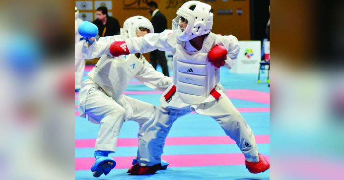 sports Karate_compressed_superimposed Francis Erl Jud Abundo of the Philippines unleashes a punch against Brunei’s Azlee Khairi bin Wan Zuraimi during the boys’ under-14 kumite -40kg finals of the Karate One-Youth League tournament at the SM Mall of Asia in Pasay City, where Abundo scored a dominant 7-0 victory to capture the gold medal. CONTRIBUTED PHOTO