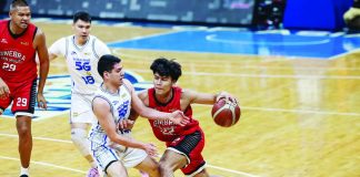 Barangay Ginebra San Miguel Kings’ John Abis drives against TNT Tropang 5G defender Mike Nieto during their PBA Season 50 Commissioner’s Cup game at the Smart Araneta Coliseum. PBA PHOTO