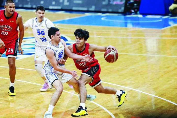 Barangay Ginebra San Miguel Kings’ John Abis drives against TNT Tropang 5G defender Mike Nieto during their PBA Season 50 Commissioner’s Cup game at the Smart Araneta Coliseum. PBA PHOTO