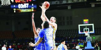 Magnolia Chicken Timplados Hotshots import Clint Chapman attacks the basket against TNT Tropang 5G’s Henry Galinato during their PBA Season 50 Commissioner’s Cup clash at the Ninoy Aquino Stadium. PBA PHOTO
