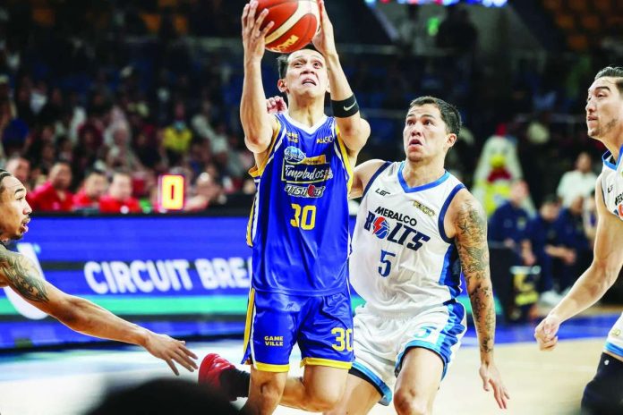 sports_Magnolia_compressed_resized Magnolia Chicken Timplados Hotshots’ Jerom Lastimosa attacks the basket for a layup during their quarterfinal victory over Meralco Bolts. PBA PHOTO