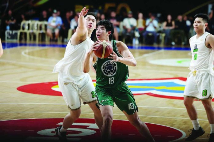 sports_Terra_compressed_resized Terrafirma Dyip center Geo Chiu attacks his Macau Black Knights defender. PBA PHOTO