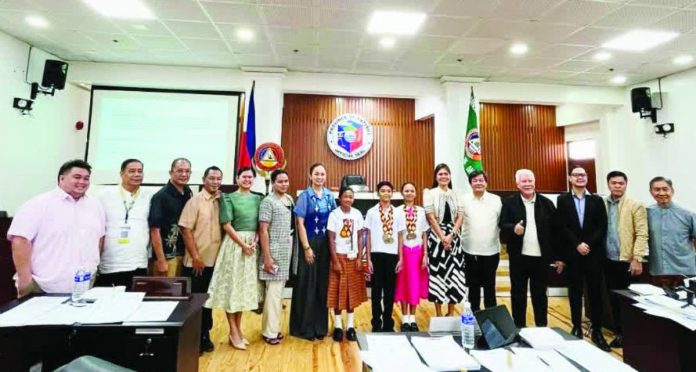 Antique athletes_compressed Members of the Sangguniang Panlalawigan of Antique posed with Palarong Pambansa medalists Kent Reynald Fernandez and Precious Mae Sebullen of Belison, and Maria Cecilia Z. Piedad of San Jose de Buenavista during a recognition ceremony at the SP Session Hall on Monday. The provincial board commended six Antiqueño athletes who won medals in the 2026 Palarong Pambansa in Agusan del Sur and is set to pass a resolution honoring their achievements. MACKY TORRECHILLA PHOTO