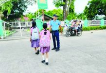 DepEd postpones school attack drill as experts warn realistic simulations may distress learners A police officer monitors students at a school in Antique as part of the Antique Provincial Police Office’s intensified security measures for the opening of classes. The APPO has increased police visibility in schools across the province to help ensure the safety of learners and school personnel while promoting a secure and orderly learning environment. APPO PHOTO