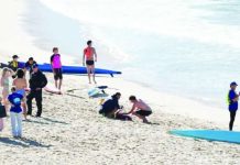 Woman seriously injured in shark attack at Sydney beach Police officers speak to people following a shark attack at Coogee Beach in Sydney, Australia. REUTERS