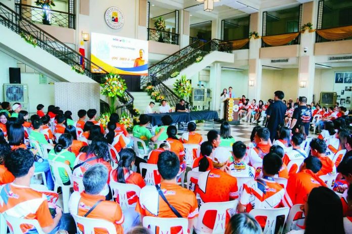 Mayor Greg Gasataya leads the distribution of P1.782 million in cash incentives to Bacolod City's athletes, coaches, trainers, and chaperones who represented the Negros Island Region in the 2026 Palarong Pambansa during a ceremony at the Bacolod City Government Center on June 18. BCCO-PIO PHOTO