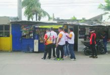 Bacolod CLO orders removal of trade fair market structures, seeks explanation from village chief Personnel from the Bacolod City Legal Office (CLO) served notices to stall owners at the Asenso Market Trade Fair in Barangay Alijis, directing them to remove permanent structures allegedly occupying public roads and sidewalks. The CLO also required barangay officials to explain the operation of the trade fair, citing the absence of the necessary special permits and clearances. WATCHMEN DAILY JOURNAL PHOTO