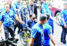 Former Department of Public Works and Highways secretary Manuel Bonoan is assisted in a wheelchair provided by court personnel upon his arrival at the Sandiganbayan in Quezon City on Tuesday, June 2, 2026. INQUIRER / GRIG C. MONTEGRANDE