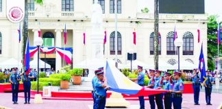 Government officials, employees, and various stakeholders stand at attention during the flag-raising ceremony in front of the Capiz Provincial Capitol as part of the 128th Philippine Independence Day celebration on June 12, 2026. CAPIZ PROV’’L TOURISM AND CULTURAL AFFAIRS OFFICE