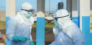 Medical staff wear protective equipment at a hospital in Bunia, Ituri Provice in the Democractic Republic of Congo. They must wear protective equipment when treating people with Ebola because it spread through bodily fluids. EPA