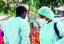 Health workers are seen at an Ebola treatment center in the Democratic Republic of Congo. Ebola treatment facilities have come under attack multiple times during the ongoing outbreak, in which almost 200 deaths and 840 cases have been confirmed. GETTY IMAGES