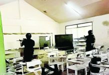 AFTER TACLOBAN SHOOTING, CAVITE STABBINGS: DepEd reviews school security nationwide Policemen search a classroom at San Jose National High School after a shooting incident on Monday morning, June 22, that left three students dead and over 10 others injured. Authorities have arrested two suspects. PNA