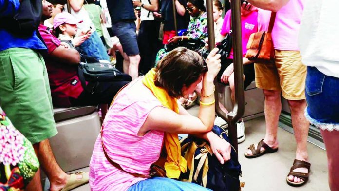 Europe_copy_compressed_resized A woman sits on the floor of a crowded carriage on metro line 11 during a heatwave in Paris. The heatwave will be "widespread, long-lasting and intense", France's forecaster warned. GETTY IMAGES