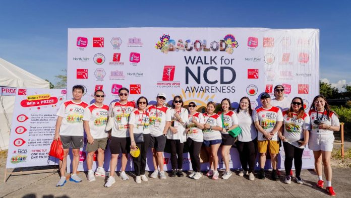 FMF06427 Mercury Drug and Mercury Drug Foundation (MDFI) executives join the Walk for NCD Awareness, along with partners from Unilab and RiteMED. In the photo are RiteMED Inc. OVP and Head Violi Remo (7th from left), Unilab AVP Marlon Carpizo (extreme left), MDFI Executive Director Annie Fuentes (4th from left), MDFI Trustee Rose Lue (5th from left) and Mercury Drug VP for Merchandising Cora Lim (6th from left)