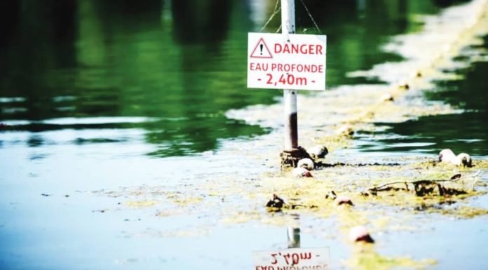 France A danger signs warns people at a river in France. The French government says too many people are heading for reservoirs and rivers without taking the risks into account. GETTY IMAGES