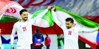 Iran’s players Omid Norafkan and Saman Ghoddos celebrate after a qualifying match. AFP VIA GETTY IMAGES