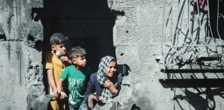 Palestinian children look out from their family’s destroyed house following an Israeli air strike, in Shati refugee camp, northern Gaza. About 30% of those killed in the Gaza war have been children, according to the United Nations commission of inquiry. EPA