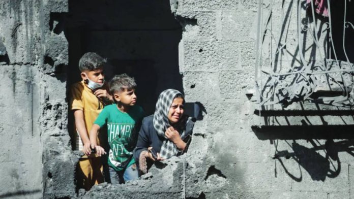 Israel Palestinian children look out from their family’s destroyed house following an Israeli air strike, in Shati refugee camp, northern Gaza. About 30% of those killed in the Gaza war have been children, according to the United Nations commission of inquiry. EPA