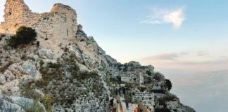 Israeli soldiers walk through the ruins of Beaufort Castle, whose keep stands high above them in the left of the picture. Beaufort Castle is a strategic fort in southern Lebanon. REUTERS