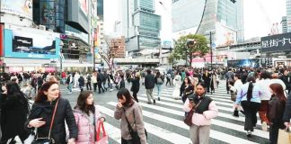 The Shibuya Crossing is one of Japan’s most famous tourist attractions. NURPHOTO VIA GETTY IMAGES
