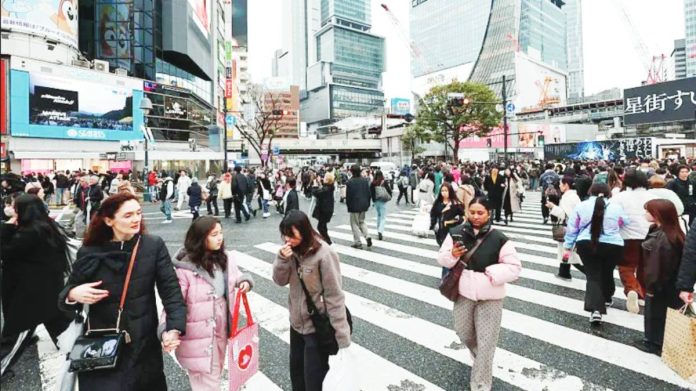 The Shibuya Crossing is one of Japan’s most famous tourist attractions. NURPHOTO VIA GETTY IMAGES