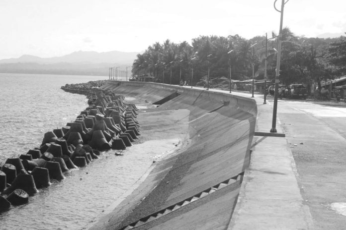 Mai Miag-ao flood control SHIELDING THE SHORELINE. A shoreline protection structure in Barangay Baybay Norte, Miag-ao, Iloilo is one of the municipality’s key defenses against storm surges, tidal flooding and overflowing river waters. Local officials credit the project with helping prevent mass evacuations that once regularly affected the coastal community during severe weather disturbances. MAI LADIAO/PN