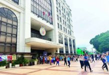 TEST OF READINESS. Employees of the Iloilo City Government cover their heads while evacuating the city hall during the National Simultaneous Earthquake Drill on June 18. While the city government posted a faster evacuation time of five minutes and 58 seconds, disaster management officials noted that some employees failed to observe key earthquake response protocols. MAI LADIAO/PN