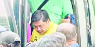 Sen. Jinggoy Estrada, who is detained over the flood control scandal, wears a yellow Persons Deprived of Liberty uniform and handcuffs as he arrives at the Sandiganbayan on June 2, 2026 for the arraignment of his graft case. MICHAEL DELIZO, ABS-CBN NEWS