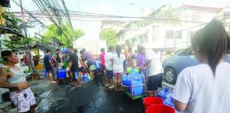 NO WATER. Residents of Florentino Street in Sampaloc, Manila queue up with their plastic containers to collect clean water from a water tanker. Government agencies have been ordered to intensify drought mitigation measures as the country braces for a prolonged El Niño. PNA