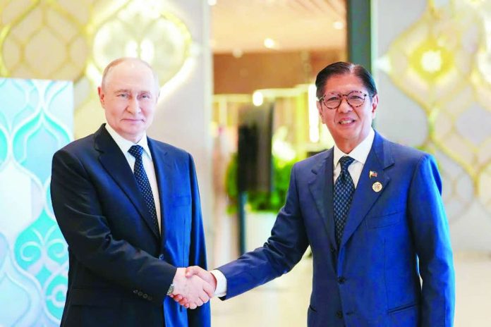Putin_copy_compressed_resized DIPLOMATIC BREAKTHROUGH. President Ferdinand Marcos Jr. and Russian President Vladimir Putin meet during the ASEAN-Russia Commemorative Summit in Kazan, Russia, where discussions led to the release and deportation of 24 Filipinos detained in Siberia for nearly nine months over immigration-related issues, paving the way for their return to the Philippines and reunion with their families. PCO