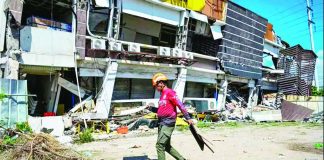 A responder prepares to take part in search and rescue operations outside a collapsed building in General Santos City on June 9, 2026. AFP