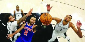 New York Knicks guard Jalen Brunson drives to the basket against San Antonio Spurs defenders Victor Wembanyama and Julian Champagnie during Game 2 of the NBA Finals in San Antonio, Texas. New York escaped with a 105-104 victory to take a 2-0 lead in the championship series. PHOTO COURTESY OF TORONTO STAR