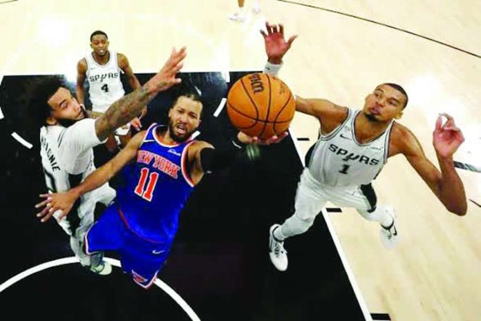 Sports_Knicks_compressed_resized New York Knicks guard Jalen Brunson drives to the basket against San Antonio Spurs defenders Victor Wembanyama and Julian Champagnie during Game 2 of the NBA Finals in San Antonio, Texas. New York escaped with a 105-104 victory to take a 2-0 lead in the championship series. PHOTO COURTESY OF TORONTO STAR