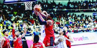 Barangay Ginebra San Miguel Kings’ Justin Brownlee is forced to a tough shot by the defense of TNT Tropang 5G’s Calvin Oftana. PBA PHOTO