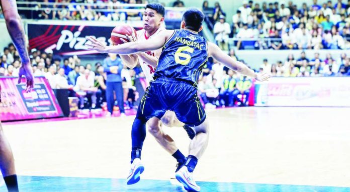 Nard John Pinto celebrates after delivering two clutch fourth-quarter three-pointers that helped power Barangay Ginebra San Miguel to an 88-76 Game 7 victory over TNT Tropang 5G and the PBA Season 50 Commissioner’s Cup championship. PBA PHOTO