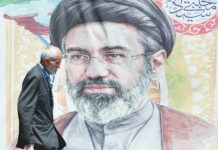 Iran’s supreme leader says Trump made deal ‘out of desperation’ An Iranian man walks past a poster of Supreme Leader Mojtaba Khamenei in Tehran. EPA