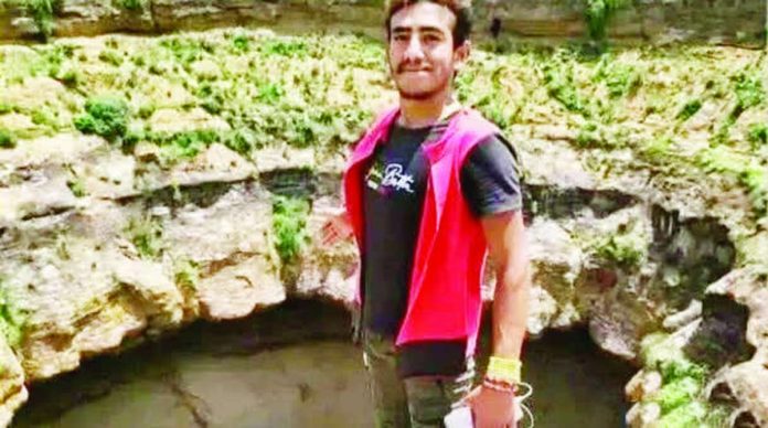 This photo shows free-climber Al-Qaqa Ibn Antar standing next to a volcanic crater before his fatal accidental fall. YEMEN CIVIL DEFENSE AUTHORITY