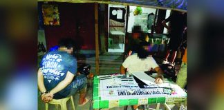 Police operatives inventory the suspected shabu and a caliber .45 pistol recovered from alias “Chad” (left), who was caught on June 8 in Barangay Rizal Lapuz Sur, Lapuz, Iloilo City. ICPO PHOTO