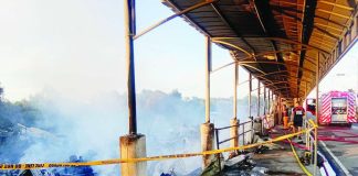 Smoke continues to rise from the remains of 10 carinderias destroyed by an early morning fire at Dumangas port in Sitio Naluoyan, Barangay Sapao, Dumangas, Iloilo on Sunday, June 28, 2026. BOMBO RADYO ILOILO/FACEBOOK PHOTO