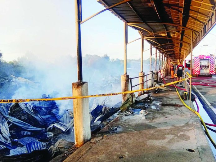 dumangas_fire_copy_compressed_resized Smoke continues to rise from the remains of 10 carinderias destroyed by an early morning fire at Dumangas port in Sitio Naluoyan, Barangay Sapao, Dumangas, Iloilo on Sunday, June 28, 2026. BOMBO RADYO ILOILO/FACEBOOK PHOTO