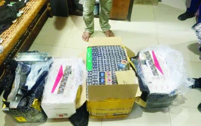 illegal_cigs_copy_compressed_resized Police seize P25 million worth of illegal cigarettes in an operation in Estancia, Iloilo on June 25, 2026. A woman was arrested for alleged unlawful possession or removal of articles subject to excise tax without payment. PNA/PHOTO FROM THE ILOILO POLICE PROVINCIAL OFFICE